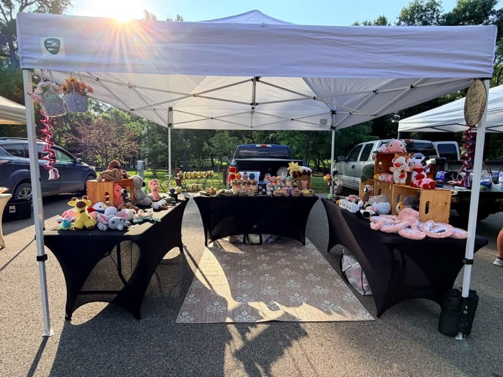 Rustic Crochet market booth with handmade crochet plushies